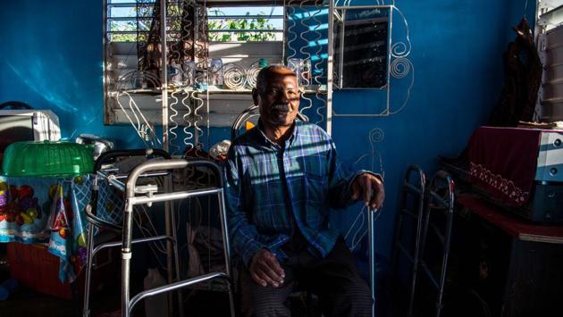 Osner Di'Pre, 60, was left paralysed in the left side of his body from injuries during the 2010 earthquake. “In the cities after five or six o’clock, you have to stay inside, and doors have iron gates,” Saint-Pierre said. “I’m getting too old to hear gunshots at all hours of the day and night,” the 62-year-old added. (Chandan Khanna/AFP) Osner Di'Pre, 60, was left paralysed in the left side of his body from injuries during the 2010 earthquake. “In the cities after five or six o’clock, you have to stay inside, and doors have iron gates,” Saint-Pierre said. “I’m getting too old to hear gunshots at all hours of the day and night,” the 62-year-old added. (Chandan Khanna/AFP)