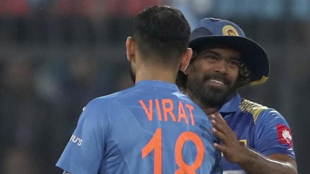 India's captain Virat Kohli, left greets Sri Lanka's captain Lasith Malinga.(AP)