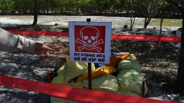 A landmine site in the Trieu Phong district in Quang Tri province. “He died in an explosion. I was haunted by memories of him,” Ngoc told AFP as she oversaw the controlled detonation of a cluster bomb found in a sealed-off site in central Quang Tri province. (Nhac Nguyen/AFP) A landmine site in the Trieu Phong district in Quang Tri province. “He died in an explosion. I was haunted by memories of him,” Ngoc told AFP as she oversaw the controlled detonation of a cluster bomb found in a sealed-off site in central Quang Tri province. (Nhac Nguyen/AFP)
