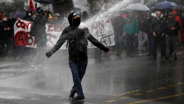 A demonstrator faces off against French gendarmes during a demonstration by French labour union members and workers in Nantes during the 36th consecutive day of strike against French government’s pensions reform plans in France. (Stephane Mahe / REUTERS) A demonstrator faces off against French gendarmes during a demonstration by French labour union members and workers in Nantes during the 36th consecutive day of strike against French government’s pensions reform plans in France. (Stephane Mahe / REUTERS)