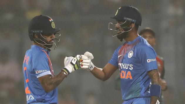 India's Shikhar Dhawan acknowledges K.L. Rahul's shot(AP)