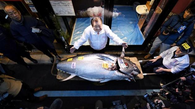 Kiyoshi Kimura, president of Kiyomura Corp., operator of the Japanese sushi chain Sushizanmai, poses with a bluefin tuna that was auctioned for 193 million Japanese yen (about $1.8 million) in Tokyo, Japan. (Kyodo/via REUTERS) Kiyoshi Kimura, president of Kiyomura Corp., operator of the Japanese sushi chain Sushizanmai, poses with a bluefin tuna that was auctioned for 193 million Japanese yen (about $1.8 million) in Tokyo, Japan. (Kyodo/via REUTERS)