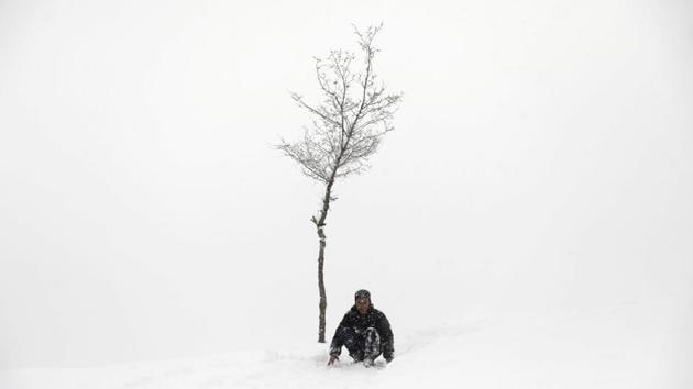 A boy slides down a snow-covered slope in Kabul, Afghanistan. (Mohammad Ismail / REUTERS) A boy slides down a snow-covered slope in Kabul, Afghanistan. (Mohammad Ismail / REUTERS)