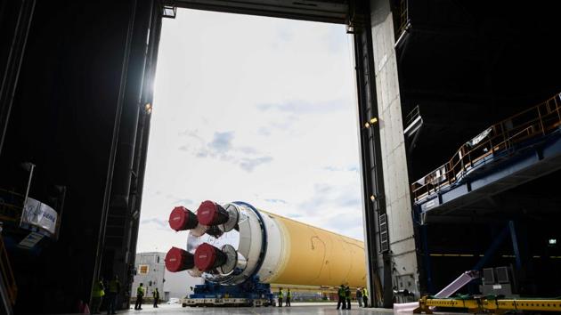 NASA’s powerful new rocket, the Space Launch System (SLS), which will send astronauts a quarter million miles from Earth to lunar orbit, is seen at the Michoud Assembly Facility in New Orleans, Louisiana. The massive SLS core stage is being readied for the Pegasus barge and its trip to NASA’s Stennis Space Center. (Jude Guidry / NASA / AFP) NASA’s powerful new rocket, the Space Launch System (SLS), which will send astronauts a quarter million miles from Earth to lunar orbit, is seen at the Michoud Assembly Facility in New Orleans, Louisiana. The massive SLS core stage is being readied for the Pegasus barge and its trip to NASA’s Stennis Space Center. (Jude Guidry / NASA / AFP)