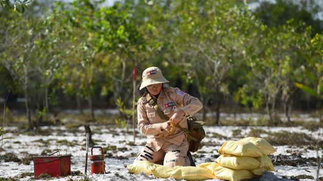 For the past 20 years, Ngoc has worked as a deminer with Mines Advisory Group (MAG), funded by the United States, Britain and Japan. Today the 42-year-old criss-crosses her home province to excavate up to a dozen pieces of unexploded ordnance daily—and she is not alone. (Nhac Nguyen/AFP) For the past 20 years, Ngoc has worked as a deminer with Mines Advisory Group (MAG), funded by the United States, Britain and Japan. Today the 42-year-old criss-crosses her home province to excavate up to a dozen pieces of unexploded ordnance daily—and she is not alone. (Nhac Nguyen/AFP)
