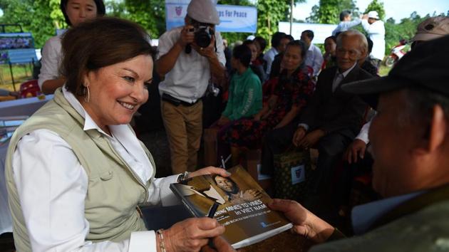 Heidi Kuhn, founder of NGO group Roots of Peace, which has helped 3,000 people to farm pepper on former mine fields, presents a book about farmers who became landmine victims in Quang Tri province. “Demine, replant, rebuild—we are in the business of peace, the economy of peace,” Kuhn told AFP. Vietnam is the world’s leading producer of black pepper. (Nhac Nguyen/AFP) Heidi Kuhn, founder of NGO group Roots of Peace, which has helped 3,000 people to farm pepper on former mine fields, presents a book about farmers who became landmine victims in Quang Tri province. “Demine, replant, rebuild—we are in the business of peace, the economy of peace,” Kuhn told AFP. Vietnam is the world’s leading producer of black pepper. (Nhac Nguyen/AFP)