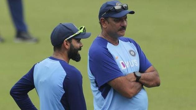 Indian cricket captain Virat Kohli, left, speaks with coach Ravi Shastri during a training session (AP) Indian cricket captain Virat Kohli, left, speaks with coach Ravi Shastri during a training session (AP)