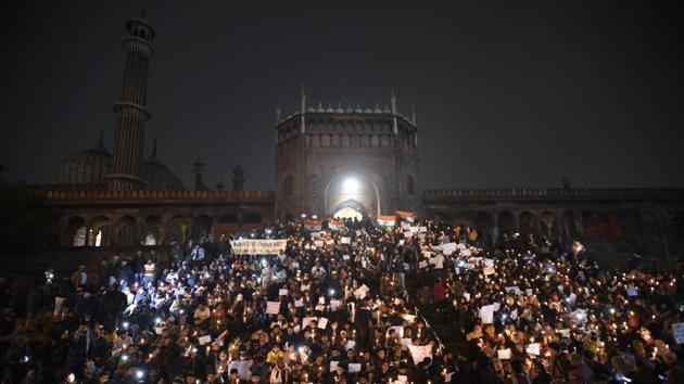 People hold placards during a candlelight march at the steps of Jama Masjid, as part of the ongoing nationwide protests against Citizenship Amendment Act (CAA), a proposed nationwide National Register of Citizens (NRC), National Population Register (NPR) and in solidarity with the students of JNU on Wednesday, January 8. (Burhaan Kinu / HT Photo) People hold placards during a candlelight march at the steps of Jama Masjid, as part of the ongoing nationwide protests against Citizenship Amendment Act (CAA), a proposed nationwide National Register of Citizens (NRC), National Population Register (NPR) and in solidarity with the students of JNU on Wednesday, January 8. (Burhaan Kinu / HT Photo)