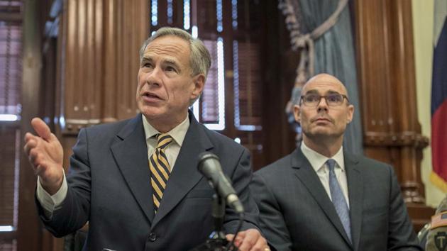 In this file photo, Gov. Greg Abbott, left, speaks at a news conference at the Capitol, in Austin, Texas. Abbott says the state will reject the re-settlement of new refugees, becoming the first state known to do so under a recent Trump administration order. (AP) In this file photo, Gov. Greg Abbott, left, speaks at a news conference at the Capitol, in Austin, Texas. Abbott says the state will reject the re-settlement of new refugees, becoming the first state known to do so under a recent Trump administration order. (AP)