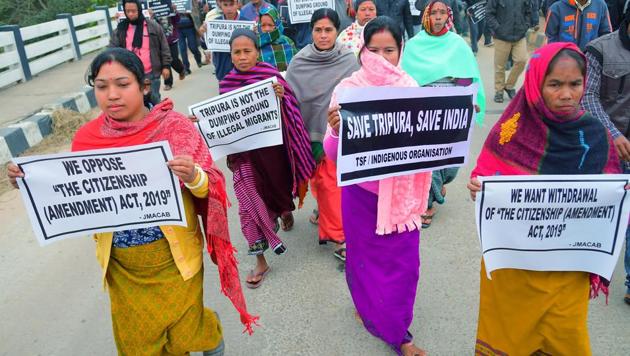 Members of Twipra Students Federation (TSF) hold placards during a protest rally against the Citizenship Amendment Act, in Agartala.(Photo: ANI)