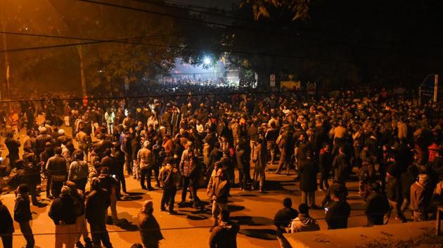People gather outside the main gate of JNU after students were attacked by masked goons, on the intervening night of January 5 and 6. The attack came amid ongoing nationwide protests that rocked the country after the enactment of the Citizen Amendment Act (CAA). (Amal KS / HT Photo) People gather outside the main gate of JNU after students were attacked by masked goons, on the intervening night of January 5 and 6. The attack came amid ongoing nationwide protests that rocked the country after the enactment of the Citizen Amendment Act (CAA). (Amal KS / HT Photo)