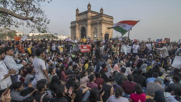 People at the ‘Occupy Gateway’ protest in Mumbai on Monday. The protest at the iconic Gateway of India had kicked off hours after the attack at JNU. On Tuesday, the organisers called off the protest hours after they were moved to Azad Maidan by the police. However, they said they will continue the protests at other locations in the city. The protesters said it was an achievement that they managed to occupy Gateway for 40 hours. (Pratik Chorge / HT Photo) People at the ‘Occupy Gateway’ protest in Mumbai on Monday. The protest at the iconic Gateway of India had kicked off hours after the attack at JNU. On Tuesday, the organisers called off the protest hours after they were moved to Azad Maidan by the police. However, they said they will continue the protests at other locations in the city. The protesters said it was an achievement that they managed to occupy Gateway for 40 hours. (Pratik Chorge / HT Photo)