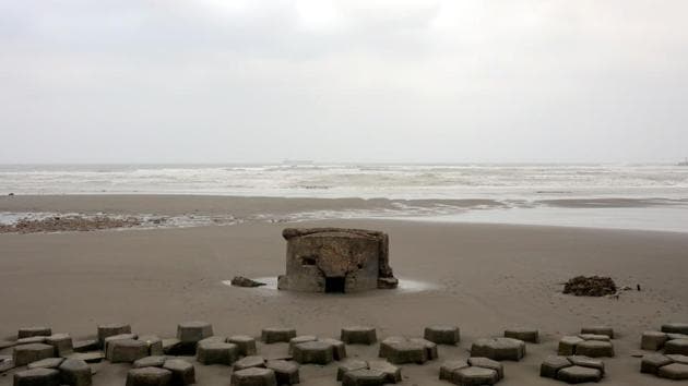 A half-submerged pillbox stands among the coastline of Taoyuan, Taiwan. Clam farmer Ding Long-kai, who would not reveal his age other than to say he was in his mid-60s, remembers as a child the pillboxes along the beaches of Yunlin on Taiwan’s western coast, which lies on the Taiwan Strait facing China. “It was restricted to go to the beach and get close to the pillboxes,” Ding said. (Ann Wang / REUTERS) A half-submerged pillbox stands among the coastline of Taoyuan, Taiwan. Clam farmer Ding Long-kai, who would not reveal his age other than to say he was in his mid-60s, remembers as a child the pillboxes along the beaches of Yunlin on Taiwan’s western coast, which lies on the Taiwan Strait facing China. “It was restricted to go to the beach and get close to the pillboxes,” Ding said. (Ann Wang / REUTERS)