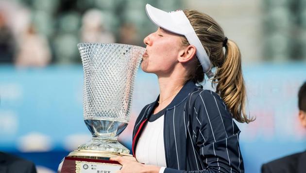 Ekaterina Alexandrova of Russia kisses the trophy(AFP)