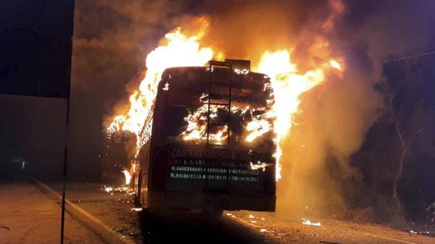 A bus catches fire after collision with a truck on GT Road, Kannauj in Uttar Pradesh on Friday. (Photo: PTI) A bus catches fire after collision with a truck on GT Road, Kannauj in Uttar Pradesh on Friday. (Photo: PTI)