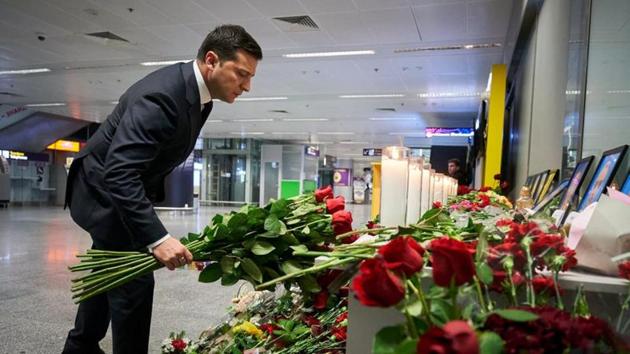 Ukrainian President Volodymyr Zelenskiy lays flowers to commemorate victims of the Ukraine International Airlines Boeing 737-800 plane crash, at a memorial in Boryspil International airport outside Kiev.(REUTERS)