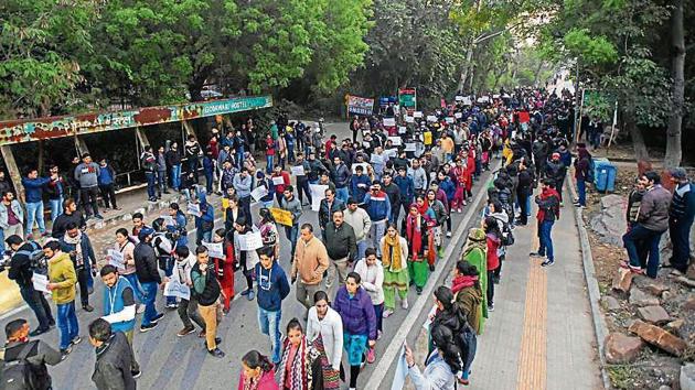 Students take part in a march inside the JNU campus on Friday. Incidents of violence were first reported from JNU on January 3 when two students groups allegedly clashed over the semester registration process.(HT Photo) Students take part in a march inside the JNU campus on Friday. Incidents of violence were first reported from JNU on January 3 when two students groups allegedly clashed over the semester registration process.(HT Photo)