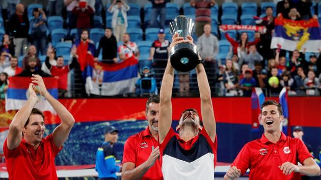 Serbia's Novak Djokovic lifts the trophy as he celebrates winning the ATP Cup with teammates.(REUTERS) Serbia's Novak Djokovic lifts the trophy as he celebrates winning the ATP Cup with teammates.(REUTERS)