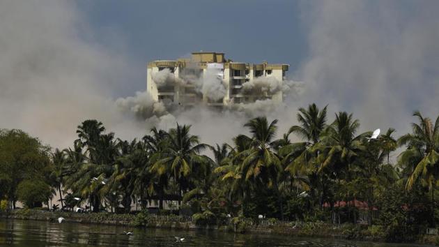 The second tower of a water-front residential apartment is demolished using controlled implosion in Kochi. Authorities in Kerala on Saturday razed down two high-rise luxury apartments in one of the largest demolition drives in India involving residential complexes for violating environmental norms. (RS Iyer/AP photo)