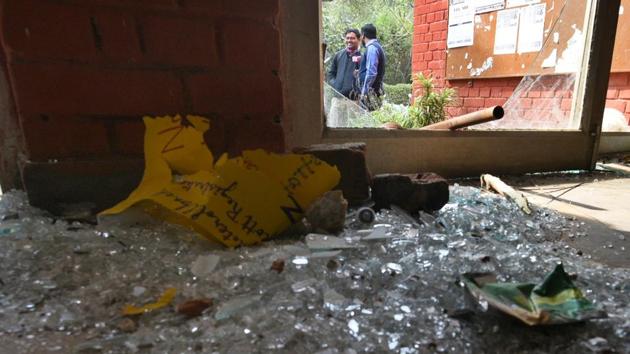 Shards of glass are seen in the premises of Sabarmati Hostel, at Jawaharlal Nehru University (JNU), in New Delhi, India, on January 6, 2020. A mob wearing masks and carrying sticks barged into the JNU campus on Sunday and attacked students and teachers.(HT)