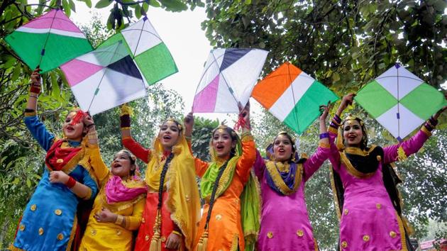 Amritsar: Young girls wearing traditional Punjabi attire pose with kites during an event ahead of Lohri festival, in Amritsar, Saturday, Jan. 11, 2020. (PTI Photo)(PTI1_11_2020_000134B)(PTI)