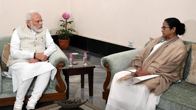 West Bengal chief minister Mamata Banerjee meeting Prime Minister Narendra Modi in Kolkata on Saturday.(ANI Photo)