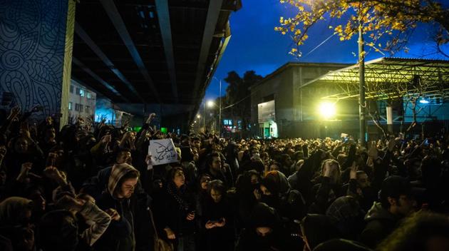 Demonstrators chant while gathering during a vigil for the victims of the Ukraine International Airlines flight that was unintentionally shot down by Iran, in Tehran, Iran, on Saturday.(Bloomberg Photo)