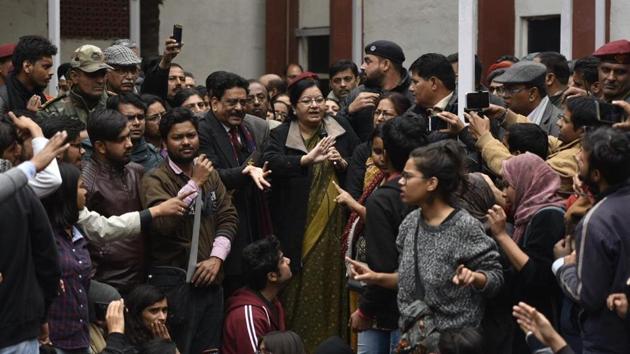 Jamia Vice Chancellor Najma Akhtar confronted by angry students on Monday who were demanding case against Delhi Police over last month’s crackdown.(Burhaan Kinu/HT Photo)