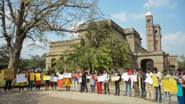 Students carry out a protest in front of the main building of Savitribai Phule Pune University in Pune, India, on Wednesday, January 8, 2020. (Milind Saurkar/HT Photo) Students carry out a protest in front of the main building of Savitribai Phule Pune University in Pune, India, on Wednesday, January 8, 2020. (Milind Saurkar/HT Photo)