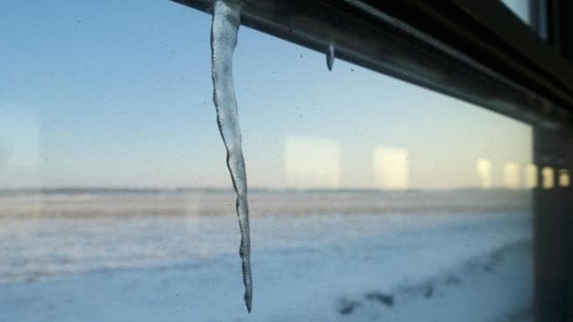 An icicle hangs off the window frame on a train heading to Hegang, Heilongjiang province. With China’s economic growth at a 30-year nadir and living costs chronically high, cheap homes in hollowed-out cities are pulling a small tribe of frugal and independent-minded millennials to Heilongjiang. (Ryan Woo / REUTERS) An icicle hangs off the window frame on a train heading to Hegang, Heilongjiang province. With China’s economic growth at a 30-year nadir and living costs chronically high, cheap homes in hollowed-out cities are pulling a small tribe of frugal and independent-minded millennials to Heilongjiang. (Ryan Woo / REUTERS)