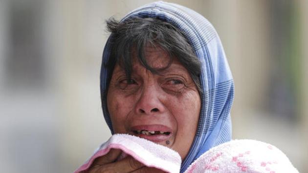 Erman Batan breaks in tears over her missing husband Roberto who she has not seen since they evacuated their homes near the Taal volcano in Lemery, Batangas. (Aaron Favila/AP) Erman Batan breaks in tears over her missing husband Roberto who she has not seen since they evacuated their homes near the Taal volcano in Lemery, Batangas. (Aaron Favila/AP)