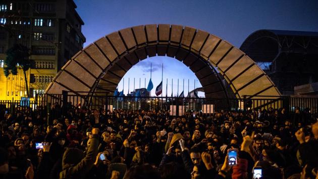 Demonstrators raise slogans during a vigil for the victims of the Ukraine International Airlines flight that was unintentionally shot down by the Iranian military, in Tehran. Iran on January 11 admitted it unintentionally shot down a Ukrainian jetliner that it mistook for a cruise missile, a dramatic reversal after days of denials that triggered international condemnation and protests in the streets of Tehran. (Ali Mohammadi/Bloomberg)