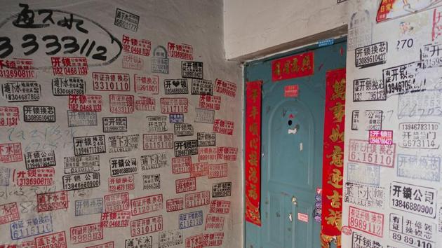 Advertisements fill the walls outside a flat at a residential compound in Hegang. Wary of frauds and tricksters, Li has few friends, who, like him, prefer not to go out. “You need money to socialise,” said Li, who earns 60,000 yuan ($8,640) a year. When not in bed with a novel, he would be posting positive product reviews online to get extra cash. (Ryan Woo / REUTERS) Advertisements fill the walls outside a flat at a residential compound in Hegang. Wary of frauds and tricksters, Li has few friends, who, like him, prefer not to go out. “You need money to socialise,” said Li, who earns 60,000 yuan ($8,640) a year. When not in bed with a novel, he would be posting positive product reviews online to get extra cash. (Ryan Woo / REUTERS)