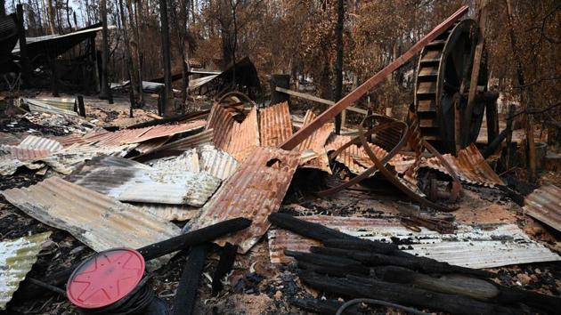 The remains of a building at the Gold Rush Colony. Images of the unprecedented scale of this summer’s blazes have evoked global shock and an outpouring of sympathy. It is expected to take months or even years to rebuild Mogo and other devastated towns -- raising fears some residents will leave to find employment elsewhere. (Holly Robertson / AFP) The remains of a building at the Gold Rush Colony. Images of the unprecedented scale of this summer’s blazes have evoked global shock and an outpouring of sympathy. It is expected to take months or even years to rebuild Mogo and other devastated towns -- raising fears some residents will leave to find employment elsewhere. (Holly Robertson / AFP)