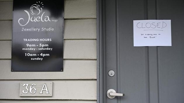 A closed sign on a business in Mogo. More than nine million overseas tourists visited Down Under in the 12 months to June 2019, adding almost Aus$45 billion ($31 billion) to the economy, while Australians holidaying across the vast continent country spent another Aus$100 billion. Tourism Australia managing director Phillipa Harrison said it was “too early to quantify the full impact of the bushfires.” (Holly Robertson / AFP) A closed sign on a business in Mogo. More than nine million overseas tourists visited Down Under in the 12 months to June 2019, adding almost Aus$45 billion ($31 billion) to the economy, while Australians holidaying across the vast continent country spent another Aus$100 billion. Tourism Australia managing director Phillipa Harrison said it was “too early to quantify the full impact of the bushfires.” (Holly Robertson / AFP)