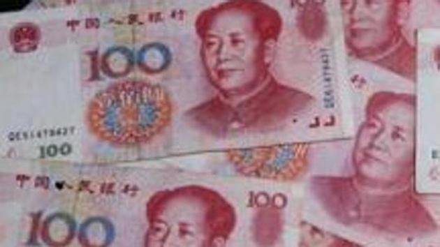 Chinese yuan notes and US dollar bills are photographed on Thursday, November 30, 2006, in New York. (Bloomberg News) Chinese yuan notes and US dollar bills are photographed on Thursday, November 30, 2006, in New York. (Bloomberg News)