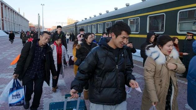 Passengers walk at a train station in Hegang. Li had few friends in his home city of Zhoushan 2,000km to the south. He had become estranged from his parents and his landlord was bent on raising his rent. Often out at sea for a stretch of six months, Li’s thinking was to build a base in Hegang and keep a lid on costs. (Ryan Woo / REUTERS) Passengers walk at a train station in Hegang. Li had few friends in his home city of Zhoushan 2,000km to the south. He had become estranged from his parents and his landlord was bent on raising his rent. Often out at sea for a stretch of six months, Li’s thinking was to build a base in Hegang and keep a lid on costs. (Ryan Woo / REUTERS)