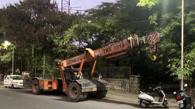 The crane had finished its work for the day at a construction site of Pune metro and was heading out when it ran over the victim on scooter on Bundgarden road Tuesday morning, according to the police. (HT PHOTO) The crane had finished its work for the day at a construction site of Pune metro and was heading out when it ran over the victim on scooter on Bundgarden road Tuesday morning, according to the police. (HT PHOTO)
