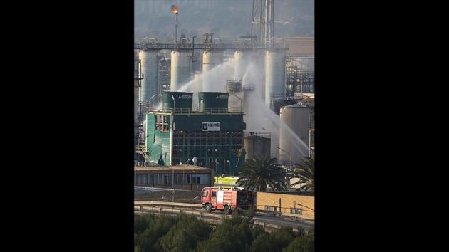 Firefighters spray water after a large fire broke out at the chemical factory. Jose Luis Morlanes, director general of IQOXE, insisted the company—whose products are used in antifreeze fluids, dehumidifiers, detergents and cosmetics—had done nothing wrong. “We have been coordinating very closely with the authorities and following all their instructions,” he told AFP. (Nacho Doce / REUTERS) Firefighters spray water after a large fire broke out at the chemical factory. Jose Luis Morlanes, director general of IQOXE, insisted the company—whose products are used in antifreeze fluids, dehumidifiers, detergents and cosmetics—had done nothing wrong. “We have been coordinating very closely with the authorities and following all their instructions,” he told AFP. (Nacho Doce / REUTERS)