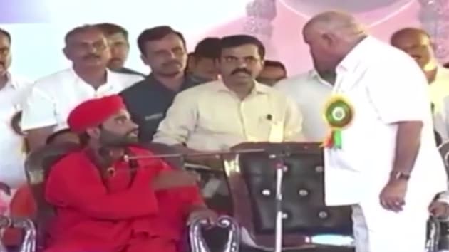 An agitated Yediyurappa immediately got up and was heard telling the Swami, ‘Don’t threaten me. You can advise but don’t threaten.” (ANI photo) An agitated Yediyurappa immediately got up and was heard telling the Swami, ‘Don’t threaten me. You can advise but don’t threaten.” (ANI photo)