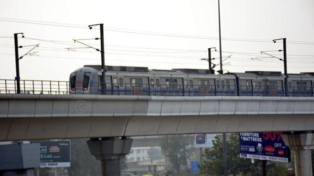 A blue line metro moves, near Kaushambi metro station, in Ghaziabad.(Sakib Ali / Hindustan Times)