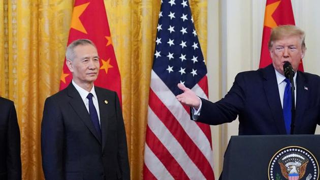 Chinese Vice Premier Liu He and his team listen to U.S. President Donald Trump as he speaks at the start of a signing ceremony for "phase one" of the U.S.-China trade agreement in the East Room of the White House in Washington, U.S.(REUTERS)