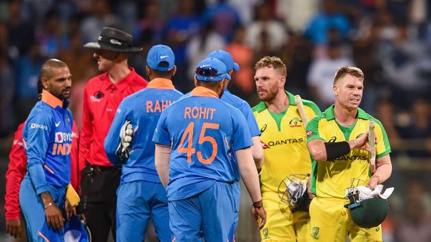 Australian batsman David Warner and Aaron Finch being congratulated by Indian players after they chased down the target to win the first one day international (ODI) cricket match at the Wankhede Stadium in Mumbai, Tuesday, Jan. 14, 2020.(PTI)