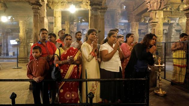 Tamil devotees pray during the Tamil harvest festival of Thai Pongal, at a Hindu temple in Colombo, Sri Lanka. (REUTERS)