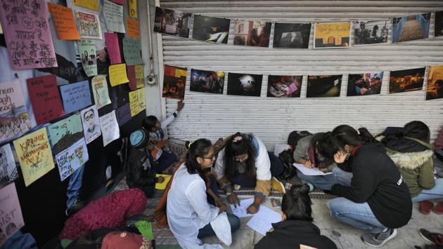Youngsters design posters at the Shaheen Bagh protest site. Mohammad Asif, 25, who is a wedding planner, closed his office and has been volunteering at the site. “There is some monetary loss for everyone. But people know that money is of no use if we cease to be citizens in our own country,” he said. (Burhaan Kinu / HT Photo) Youngsters design posters at the Shaheen Bagh protest site. Mohammad Asif, 25, who is a wedding planner, closed his office and has been volunteering at the site. “There is some monetary loss for everyone. But people know that money is of no use if we cease to be citizens in our own country,” he said. (Burhaan Kinu / HT Photo)