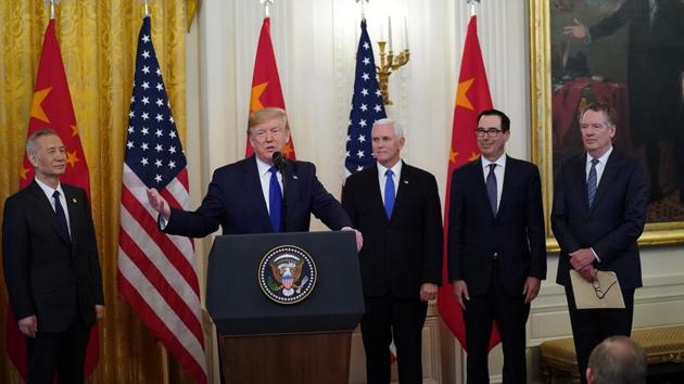 US president Donald Trump, Chinese Vice Premier Liu He, and US Vice President Mike Pence prior to signing "phase one" of the U.S.-China trade agreement with Liu in the East Room of the White House in Washington January 15, 2020.(Reuters Photo)