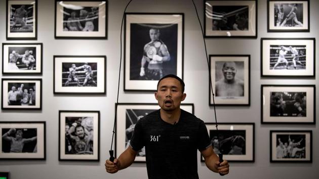 Zhang started out in martial arts but his interest in boxing was piqued when he saw a documentary about the rags-to-riches story of Philippines boxing great Manny Pacquiao. But if he hoped that he could one day earn a fortune to rival Pacquiao’s, he was badly mistaken. (Noel Celis / AFP) Zhang started out in martial arts but his interest in boxing was piqued when he saw a documentary about the rags-to-riches story of Philippines boxing great Manny Pacquiao. But if he hoped that he could one day earn a fortune to rival Pacquiao’s, he was badly mistaken. (Noel Celis / AFP)