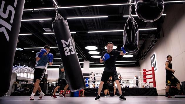 The good-natured Zhang, who grew up in rural poverty, earns so little from the sport that he has taken on an array of menial jobs to keep his boxing dream alive. He was a security guard but was fired after a few days because he was deemed too small. He also previously worked in a restaurant kitchen, in home removals and construction. (Noel Celis / AFP) The good-natured Zhang, who grew up in rural poverty, earns so little from the sport that he has taken on an array of menial jobs to keep his boxing dream alive. He was a security guard but was fired after a few days because he was deemed too small. He also previously worked in a restaurant kitchen, in home removals and construction. (Noel Celis / AFP)