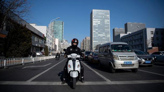 Zhang’s electric scooter -- bought for 6,000 yuan ($870) thanks to a small loan was stolen while he was delivering a meal. “I chased the person wildly for more than two kilometres but I couldn’t catch up with him,” he said in an interview at Beijing’s M23 Boxing Club. (Noel Celis / AFP) Zhang’s electric scooter -- bought for 6,000 yuan ($870) thanks to a small loan was stolen while he was delivering a meal. “I chased the person wildly for more than two kilometres but I couldn’t catch up with him,” he said in an interview at Beijing’s M23 Boxing Club. (Noel Celis / AFP)