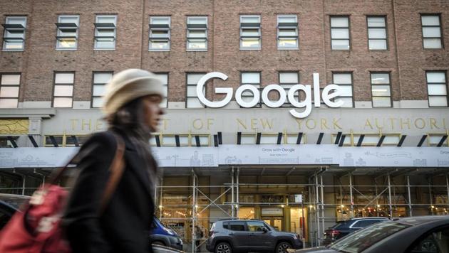 A pedestrian passes in front of Google headquarters in the Chelsea neighborhood of New York.(Bloomberg)